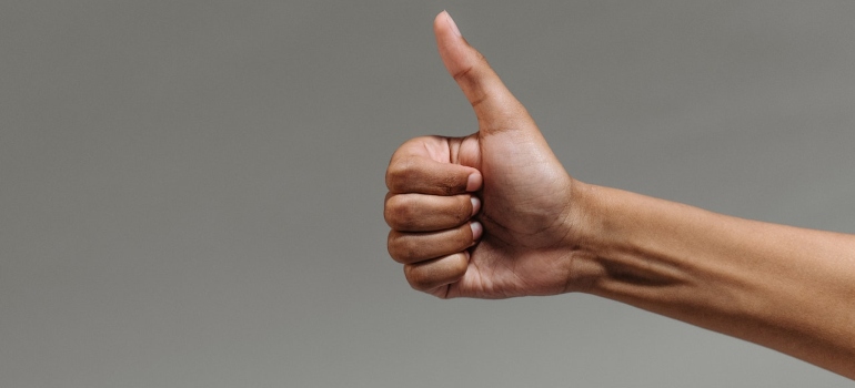 Picture of a hand making a thumbs up gesture